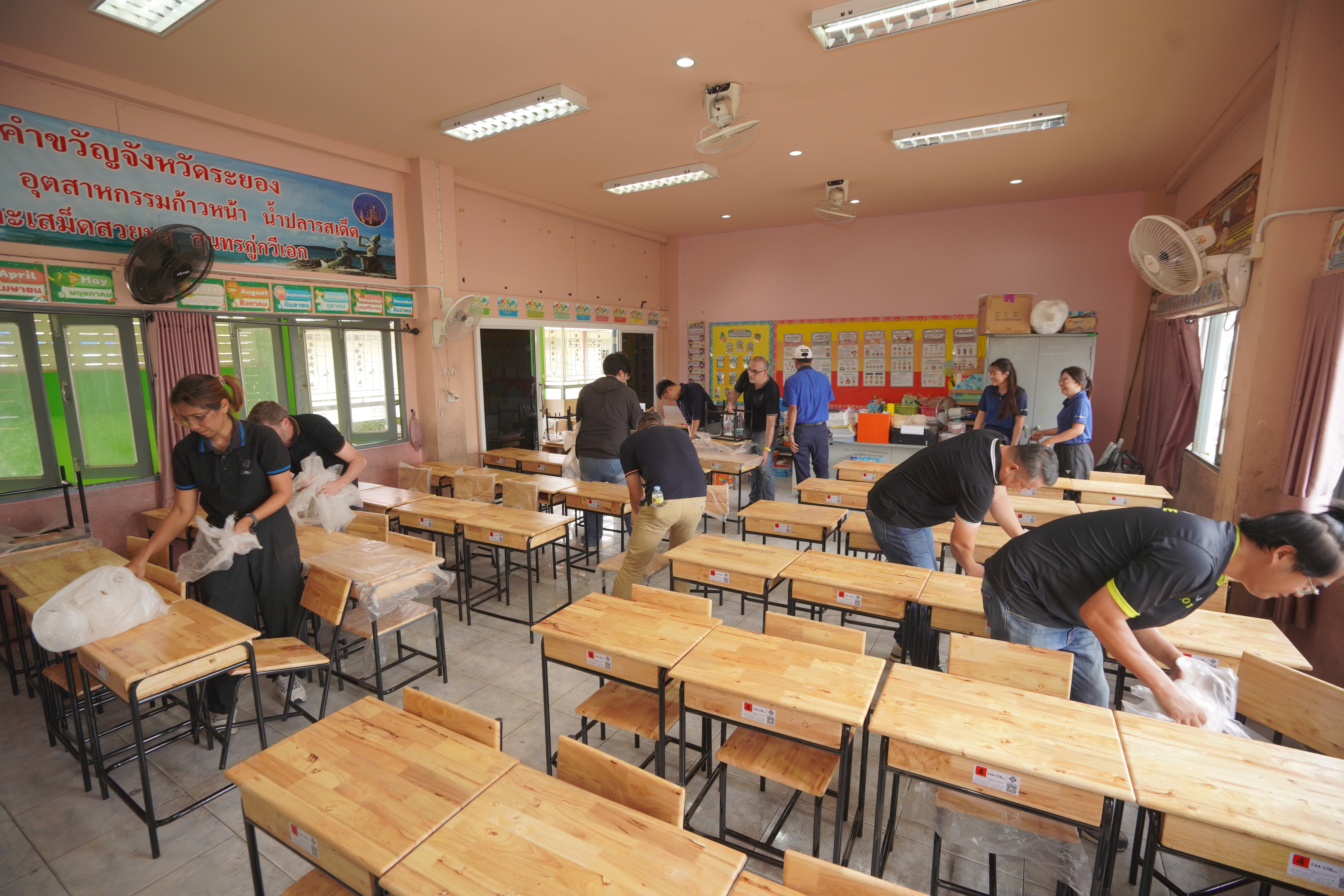 Ford and partner volunteers install new desks and at a school in Bangkok, Thailand, as part of Ford's Global Caring Month, September 2026.